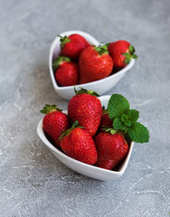 Bowls with fresh strawberries