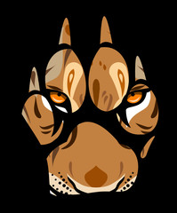 Fototapeta premium muzzle of a lioness in a paw print