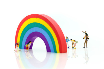 Miniature people : children and student playground in city park with rainbow...