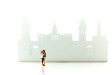 Miniature people : Happy couple of love on vacation,honeymoon , romantic concept.