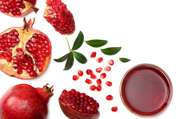 Pomegranate juice with pomegranate isolated on a white background top view
