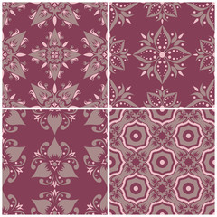 Set of violet seamless backgrounds with floral patterns