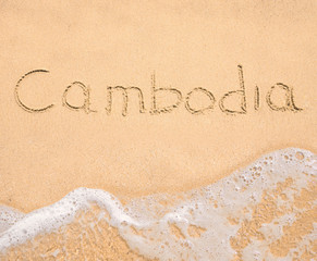 Fototapeta premium The word Cambodia written in the sand on beach