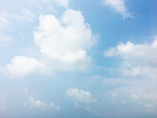 White clouds and blue sky background.