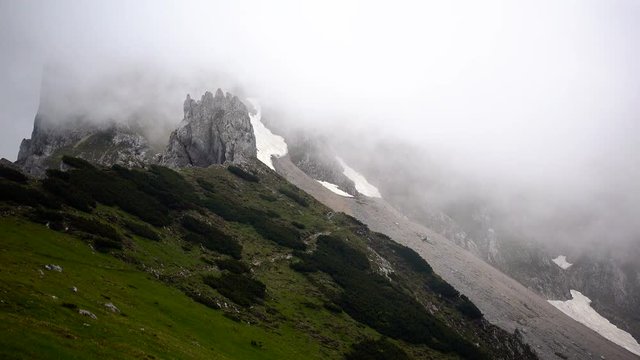 Dramatic sky over mountain ridge, floating clouds, time lapse
