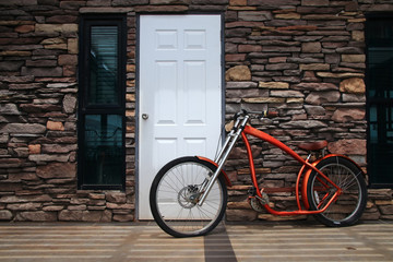 red biycle modern on stone wall background