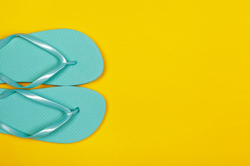 Beach flip flop on color background