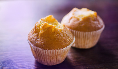 two capkake with a bitten top