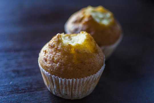 two capkake with a bitten top