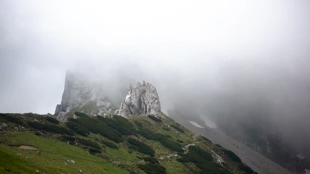Dramatic sky over mountain ridge, floating clouds, time lapse