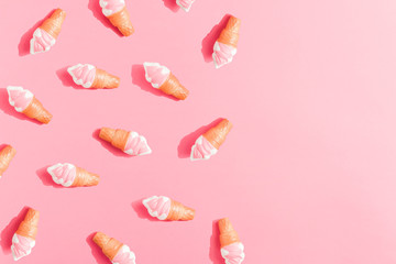 Ice cream pattern on pastel pink background. Creative minimal summer flat lay.