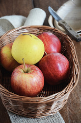 Gala and Golden Delicious apples in a basket. Healthy snack for children. Favourite fruits. View from above.