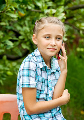 Fototapeta premium Young girl talking on mobile phone
