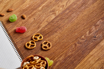Concept of school lunch break with healthy lunch box and school supplies on wooden desk, selective focus.