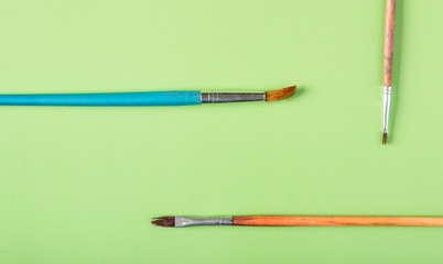 Brushes for painting on a colored background in pastel colors