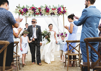 Senior couple getting married at the beach