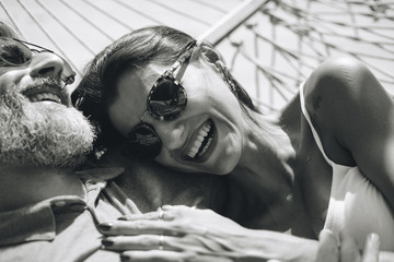 Couple resting together in a hammock
