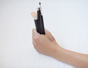 Set of makeup brushes on white background. Top view point, flat lay. Makeup natural brushes