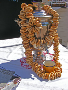 Old samovar and linking of sushka on it, dry bread-ring