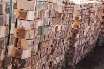 Clay bricks in stacks from side view