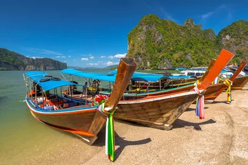 Poster Long Tail Boat, traditional wooden boats, in James Bond island, Khao Phing Kan, Phang Nga Bay, Ao Phang Nga National Park, Krabi Province, Thailand. © bennymarty