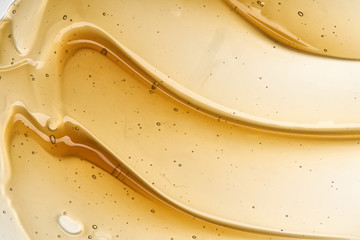 Golden smears of face cream or honey