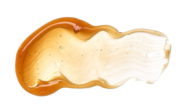 Golden smears of face cream or honey