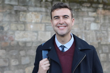 Handsome businessman smiling with copy space