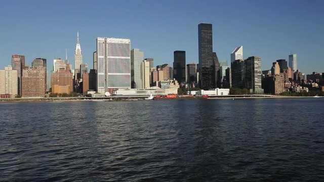 Skyline of Midtown Manhattan seen from the East River showing the Chrysler Building and the United Nations building, New York, United States of America