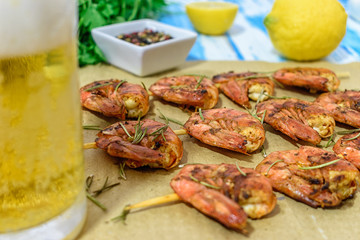 Fried prawns with fresh rosemary. Close-up.