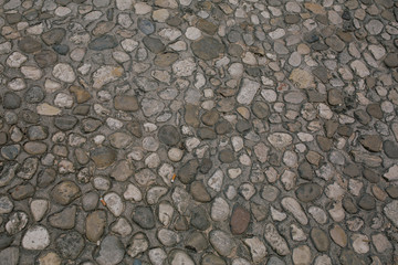 Stone in concrete ground in Italy