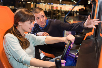 woman is playing a car driving game