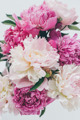 top view of beautiful pink peony bouquet on white