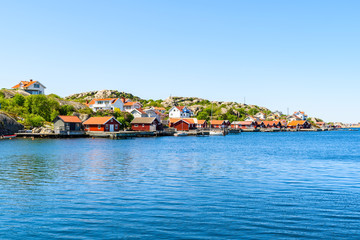 Obraz premium The coastal village of Storkalv, seen from across the sound Kalvesund outside Ronnang on Tjorn, Sweden.