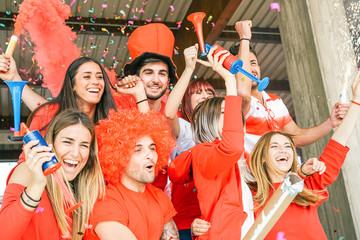 Football Supporter fans watching soccer world match at stadium - Young group of excited friends having fun supporting the winner club - Youth, sport and celebration score concept