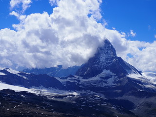 Naklejka na ściany i meble Wonderful Matterhorn mount in clouds, alpine mountains range landscape in swiss Alps seen from Gornergrat in SWITZERLAND