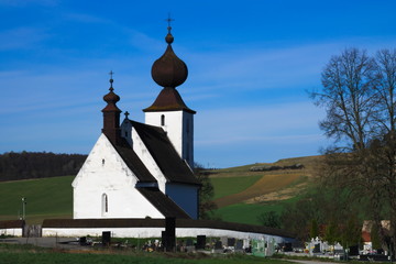Back view of the church of Žehra in early spring