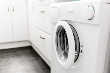washing machine built in the interior of a modern small kitchen