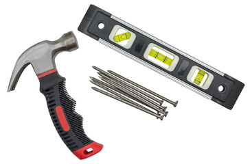 Spirit level, hammer and nails on white © AVD