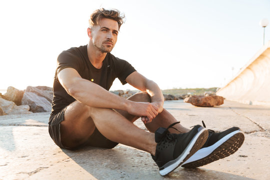 Portrait of a tired sportsman resting after work out