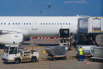 Naklejka premium airplane waiting for cargo loading