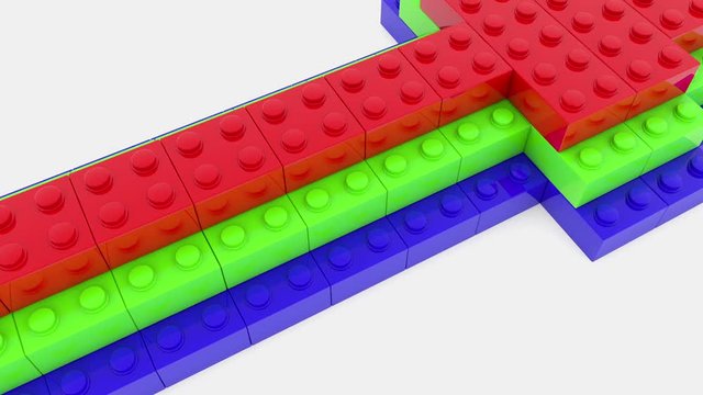 Arrow built from colorful toy bricks