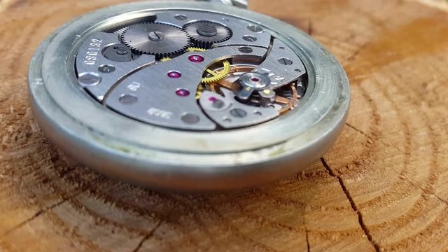 Clock Mechanism On Wooden Background