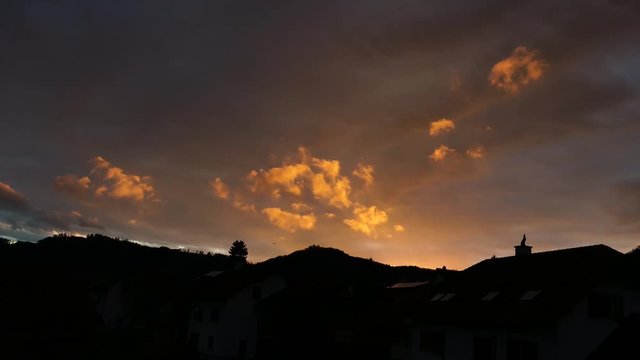 Motion Timelapse during sunset with golden glouds