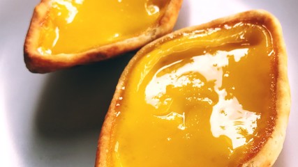This is an egg tart. Note that the shape is not circle. This is available in Singapore.