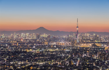 Fototapeta na wymiar Tokyo night view , Tokyo Skytree landmark with Tokyo downtown building area and Mountain Fuji in winter season