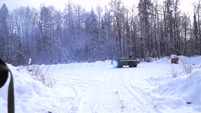 Soldier shoots a grenade launcher. Clip. Military training, fighting war, shooting big guns. Silhouette of military soldier with weapons