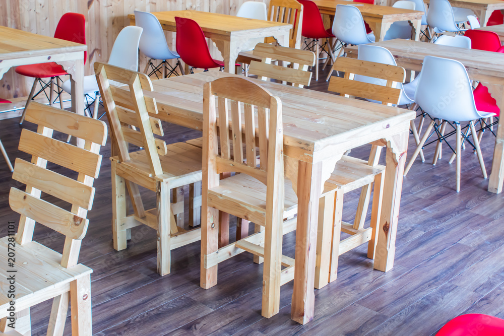 Wall mural wooden tables and chairs