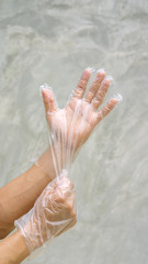 Fototapeta premium Men wear a glove on a gray background.