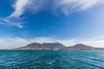 View of Table Mountain in Cape Town from the ocean with blue sky
